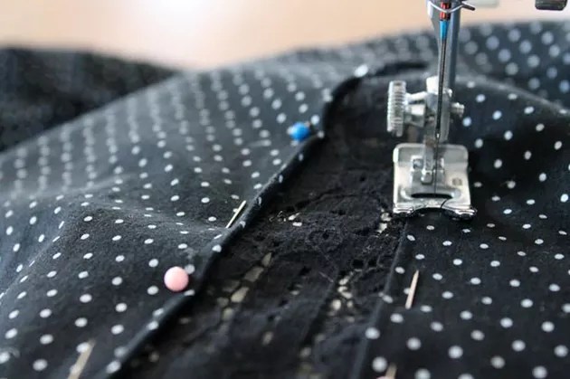 visible mending a too small shirt