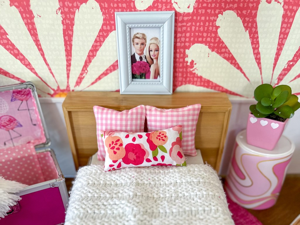 Close up of the bedroom in a modern cardboard fold-out Barbie house based on the 1962 version