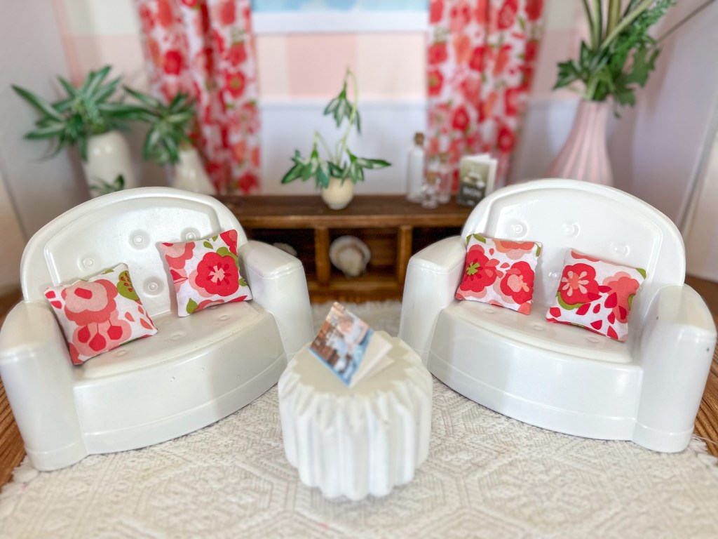 Close up of the living room in a modern cardboard fold-out Barbie house based on the 1962 version