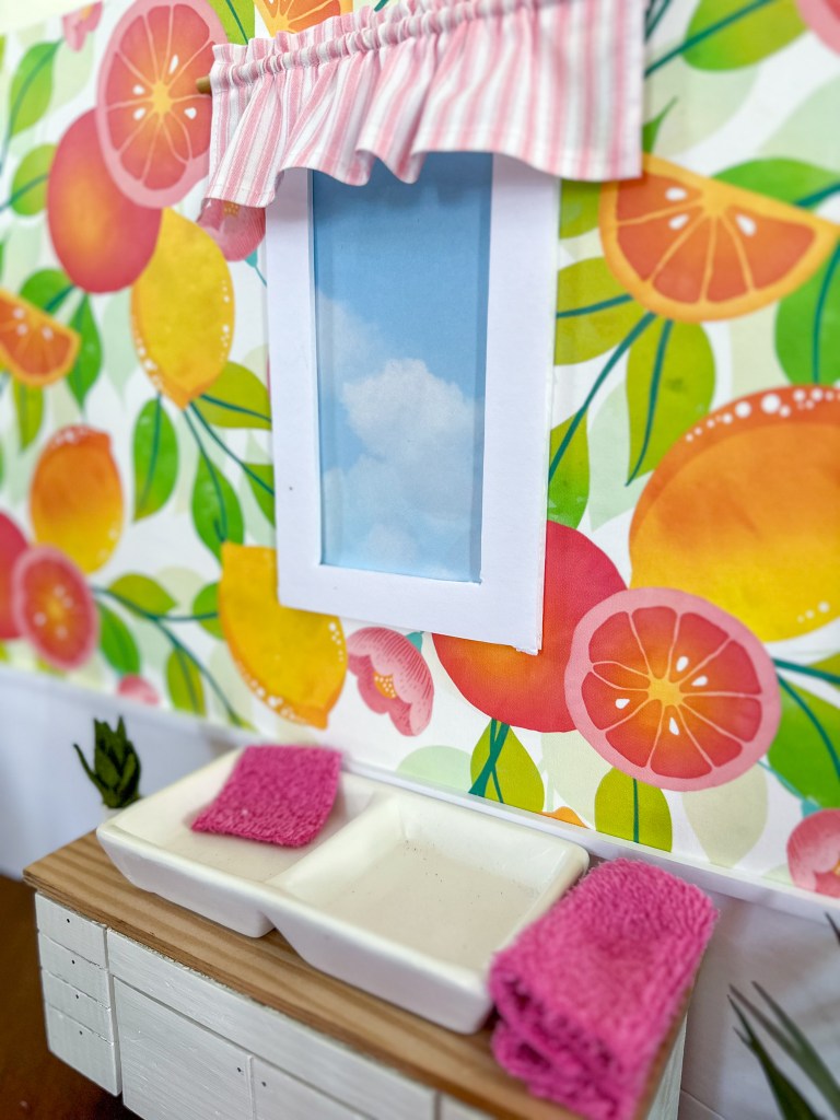Close up of the kitchen in a modern cardboard fold-out Barbie house based on the 1962 version