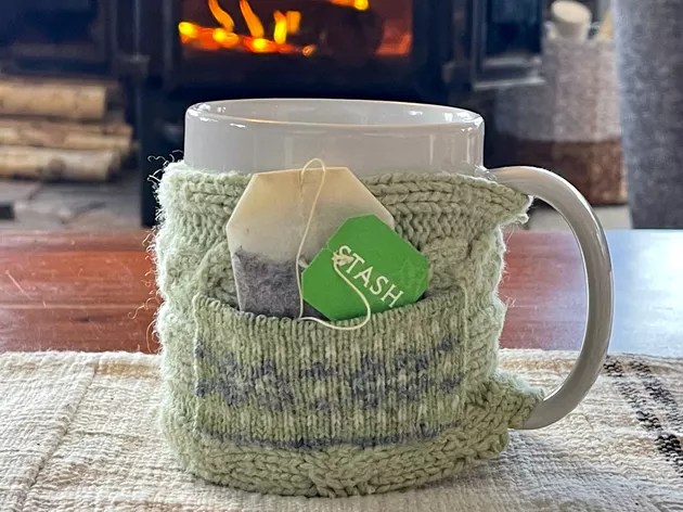 close up of a mug cozy by a fireplace