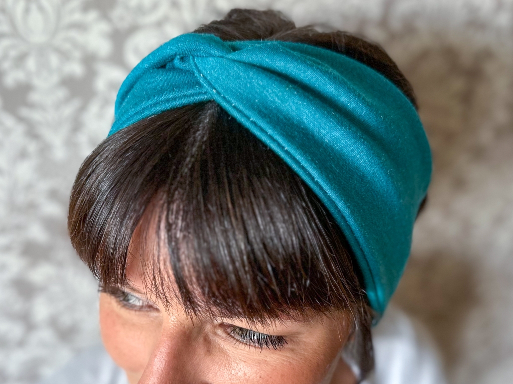 Beautiful woman modeling DIY Stretchy Twisted Headband horizontal