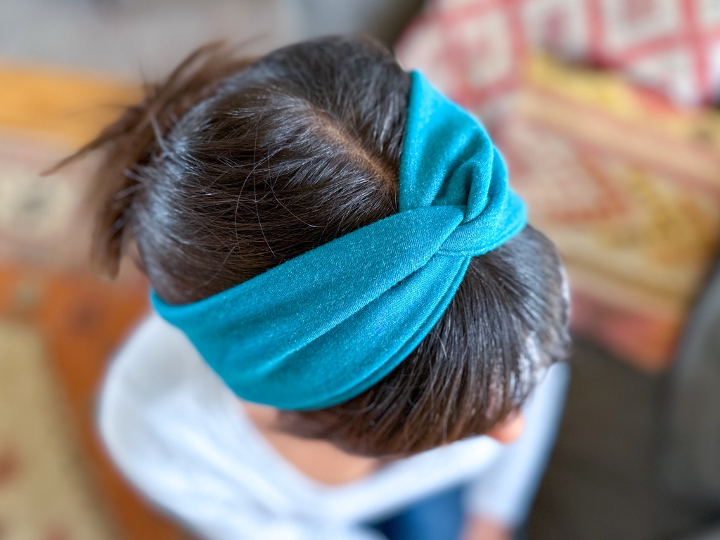 Beautiful woman modeling DIY Stretchy Twisted Headband horizontal